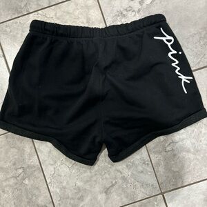 Vs pink rhtf size medium black shorts with scriot in white in perfect condition